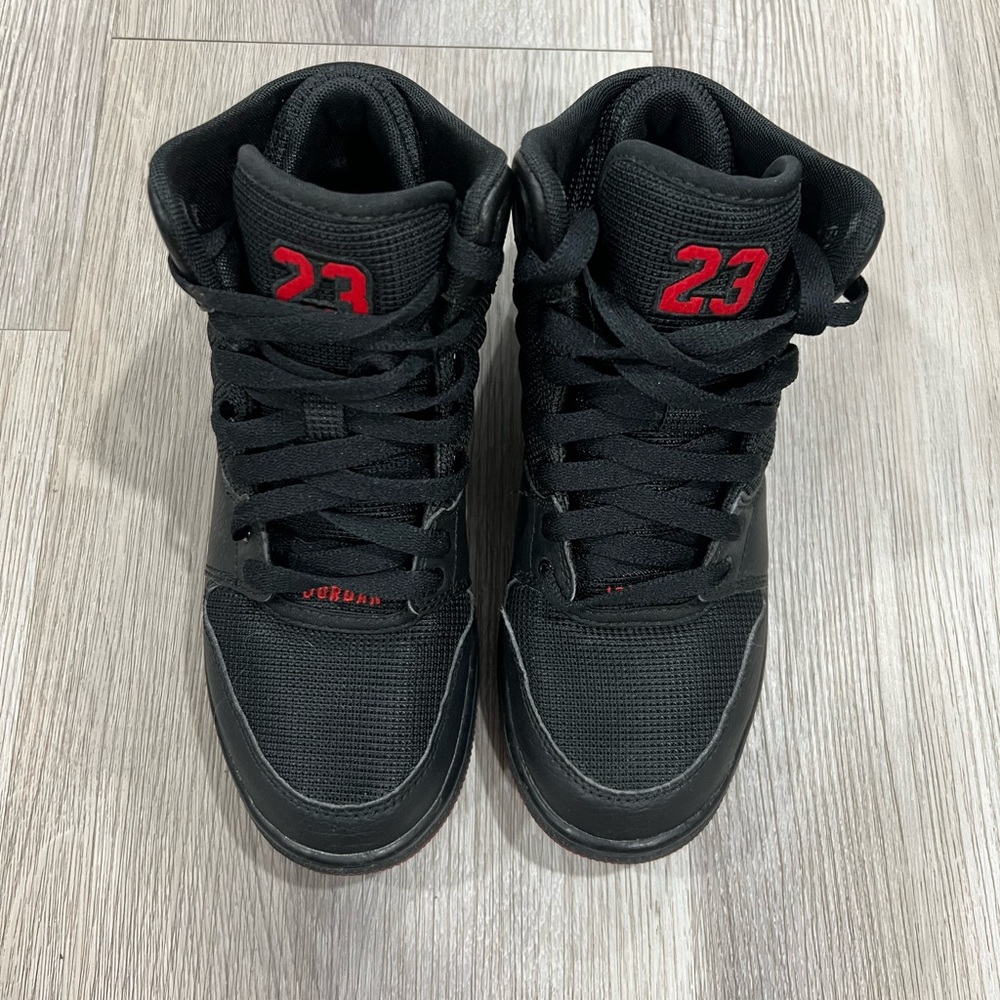 Jordan Black High-Top Sneakers with Red Tongue Tag Accent